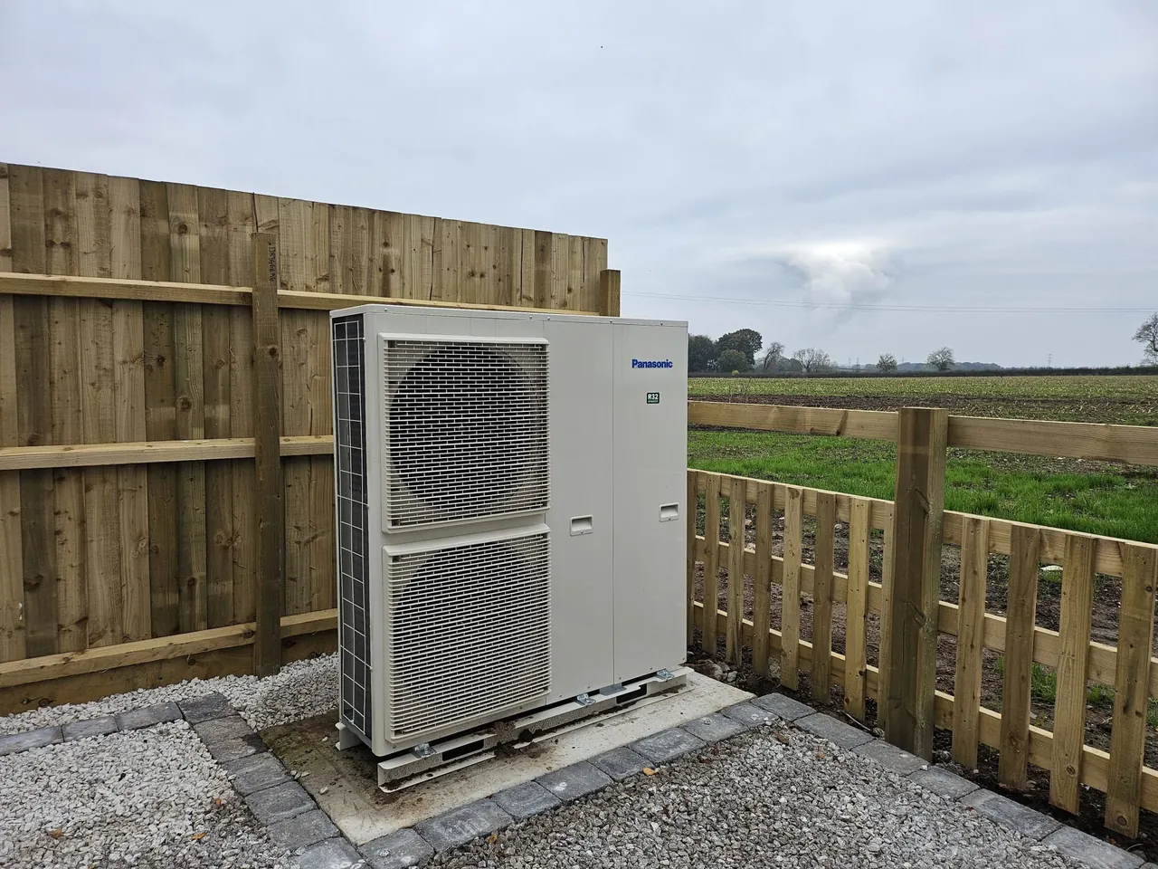 Panasonic Aquarea air source heat pump installed outside a property.